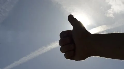 O.K. Nr. 1 Hand on sunshine and blue sky with clouds Stock Footage 40023315