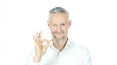 Ok Sign By Grey Haired Businessman , White Background Stock Footage