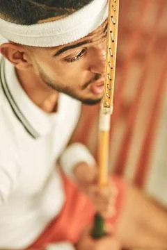 Okay racket, lets do this. a young man pressing his face up against his squash Fotos Stock
