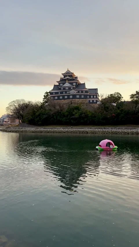 Okayama Castle during midday, reflections from the river Stock Footage 278371651