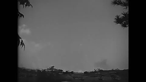 OKINAWA - 1945 - Smoke shells fly through the air and land on Japanese positions 動画素材 287744592