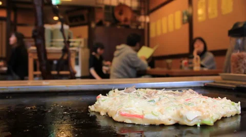 Okonomiyaki cooking in a Japanese Restaurant Stock Footage