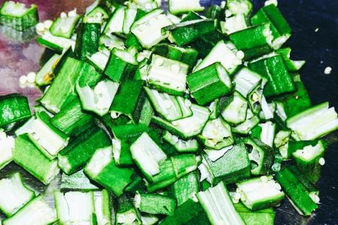 Okra slices image, green and fresh slices of ladys finger Stock Photos
