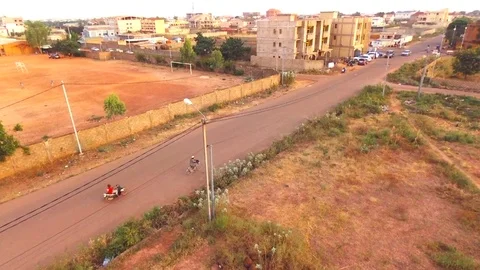 Ol man cycles in a lost street Stock Footage 80781501