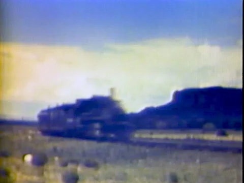 Old 1880 style train passes in desert ending on sign Stock-Footage 139947942