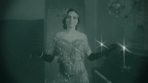 Old 20s black and white film. Happy beautiful young flapper woman smiling Stock Footage 147406557