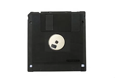 Old 3.5-inch floppy disk or diskette isolated on white background Stock Photos
