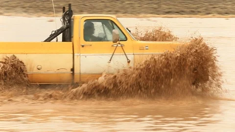 Old 4x4 Splashing Through Mud - Shallow Depth of Field Stock Footage 107074502