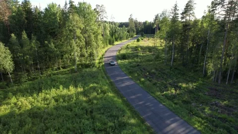 Old 70's historic and unique car driving on green landscapes and roads Stock Footage 230078990