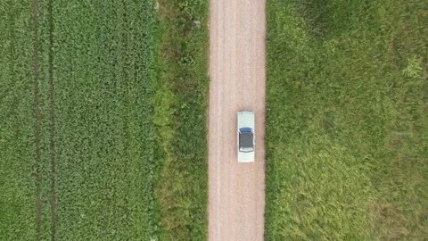 Old 70's historic and unique car driving on green landscapes and roads Stock Footage 230079181