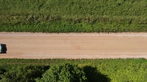 Old 70's historic and unique car driving on green landscapes and roads Stock Footage 230079286