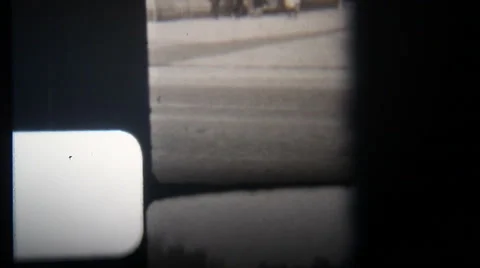 Old 8mm film projector burn frame, city street Stock Footage