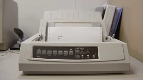 Old 9-pin dot matrix printer prints on perforated paper Stock Footage 131338748
