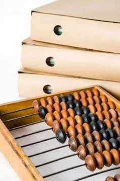 Old abacus and folders with documents, close-up Stock Photos