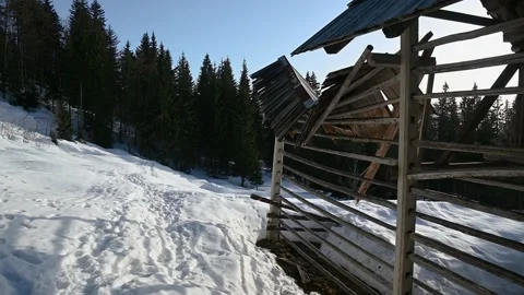 Old abandoned and ruined haystack in Alpine valley Stock Footage 150904386