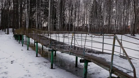 Old abandoned bridge on the pond Stock Footage 125468896