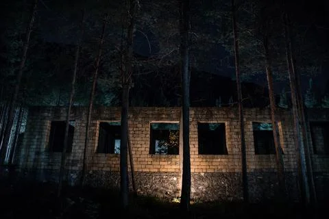 Old abandoned building in forest, Facade ruins of industrial factory. Spring  Stock Photos