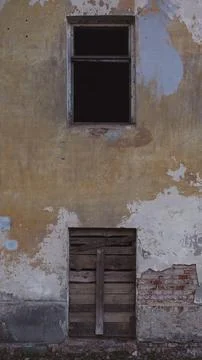 An old, abandoned building with no windows. Evening light on an building Stock Photos