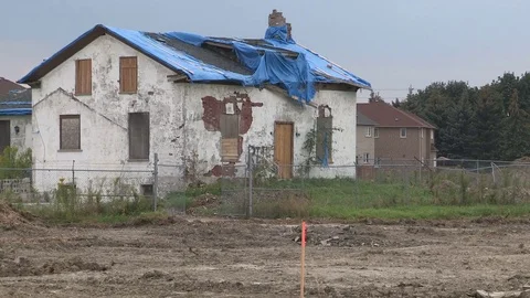 Old abandoned country home to be demolished for new suburban development Stock Footage 79528053