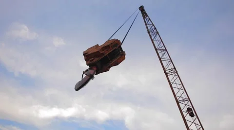 Old abandoned crane hook hanging in the air in the foreground Vídeos de archivo 68087112