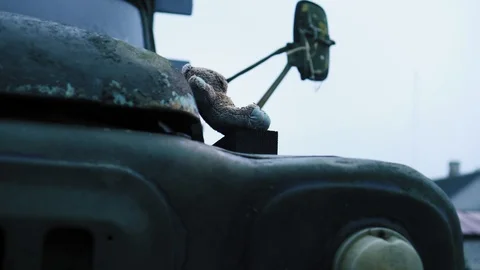 Old abandoned desolate military retro truck and near children's bear toy Stock Footage 85636195