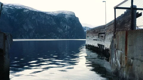 Old abandoned dock, push in low angle, sea level, revealing sea weathered wood Stock Footage 149531916