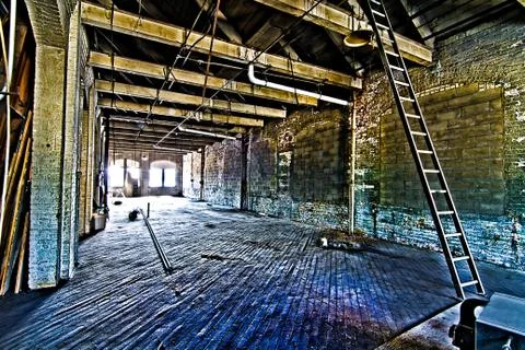 An old abandoned empty warehouse. Stock Photos