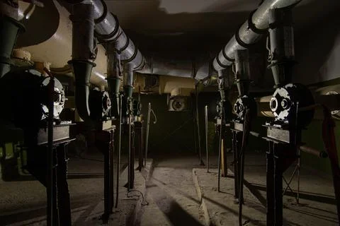 Old abandoned engine room of the ventilation system. Stock Photos