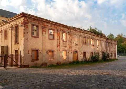 Old abandoned factory building in dramatic light Stock Photos