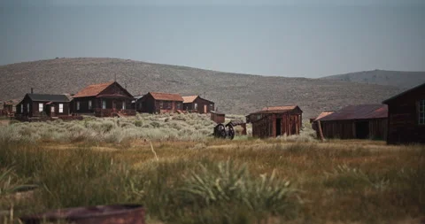 Old abandoned ghost town buildings in the hills of the gold rush area in CA Stock Footage 167337044