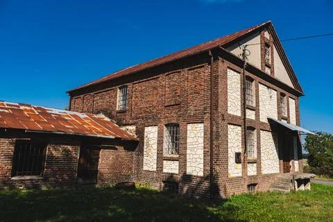 An old abandoned granary or mill built of stone and brick Stock Photos