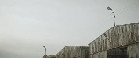 Old abandoned hangars anamorphic Stock Footage 297633322