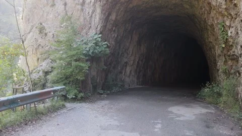 An old abandoned highway in the mountains. Closed road tunnels. Stock Footage 221298945