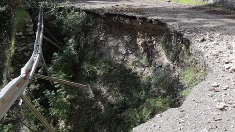 An old abandoned highway in the mountains. Rocks, mountain gorge. Stock Footage 221298061