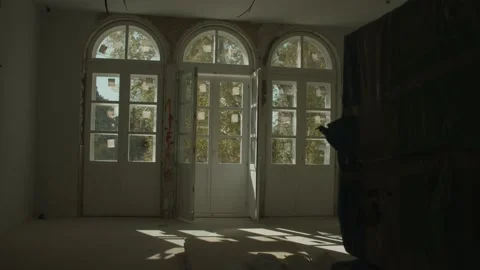 Old abandoned hotel captured on camera. Interior of a room with large Stock Footage 229216681