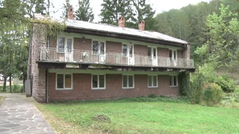 An old abandoned hotel in the forest 스톡 동영상 229504987