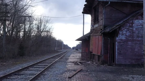 An old abandoned railways station platform and empty rail line railroad track in Stock Footage 113283982