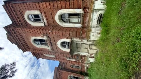 An old abandoned red brick manor a ray of light Stock Footage 198850381