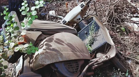 The old abandoned scooter in dust near the road in India Stock Footage 59794794