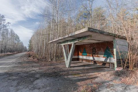 Old abandoned Soviet bus stop on the highway in the Chernobyl Exclusion Zone. Stock Photos