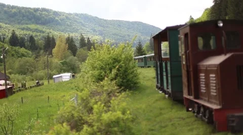 Old abandoned steam train in a mountain train station Stock Footage 63378494
