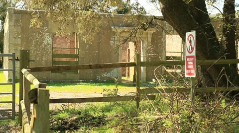 Old abandoned vicarage and warning sign Stock Footage 37601546