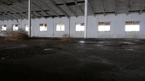 An old abandoned warehouse with broken windows Stock Footage 72985450