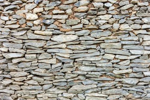 Old abstract pattern of stone wall decorative surfaces Stock Photos