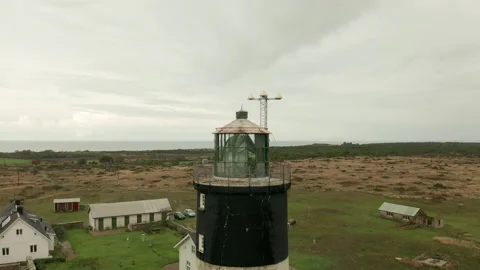 Old active Lighthouse close up, grey skies &amp; weather.keeper residence Stock Footage 142062875