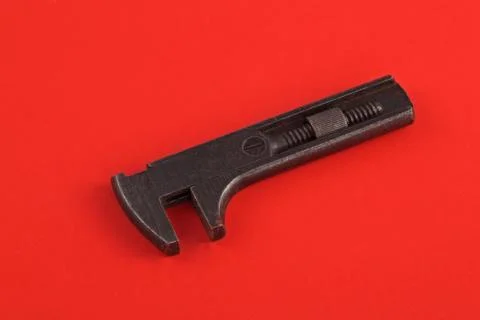 Old adjustable wrench or spanner. Stock Photos
