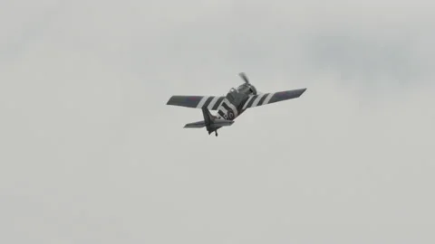 Old aeroplane of World War 2 with white and black invasion stripes Stock Footage 155696757