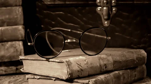 Old, aged, ancient and weathered books in a stack. Vintage. Stock Footage 60052684