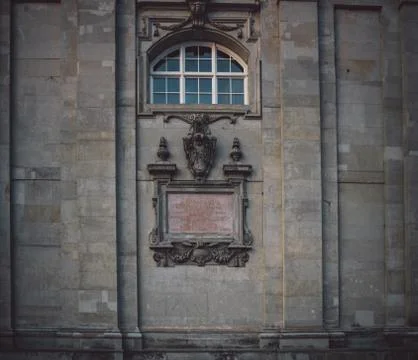Old aged church facade with old style nameplate Stock Photos