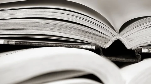 Old aged opened book pages close up macro footage Stock Footage 126927881